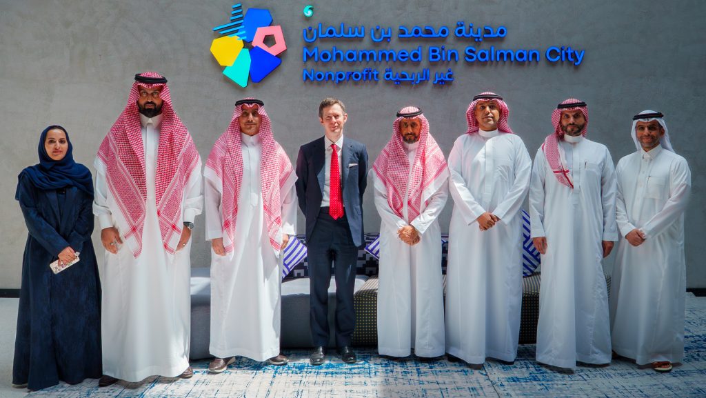Senior vice president for NHU-Riyadh, Leo Lester, with representatives of Mohammed Bin Salman Nonprofit City (“Misk City”) at a signing ceremony.